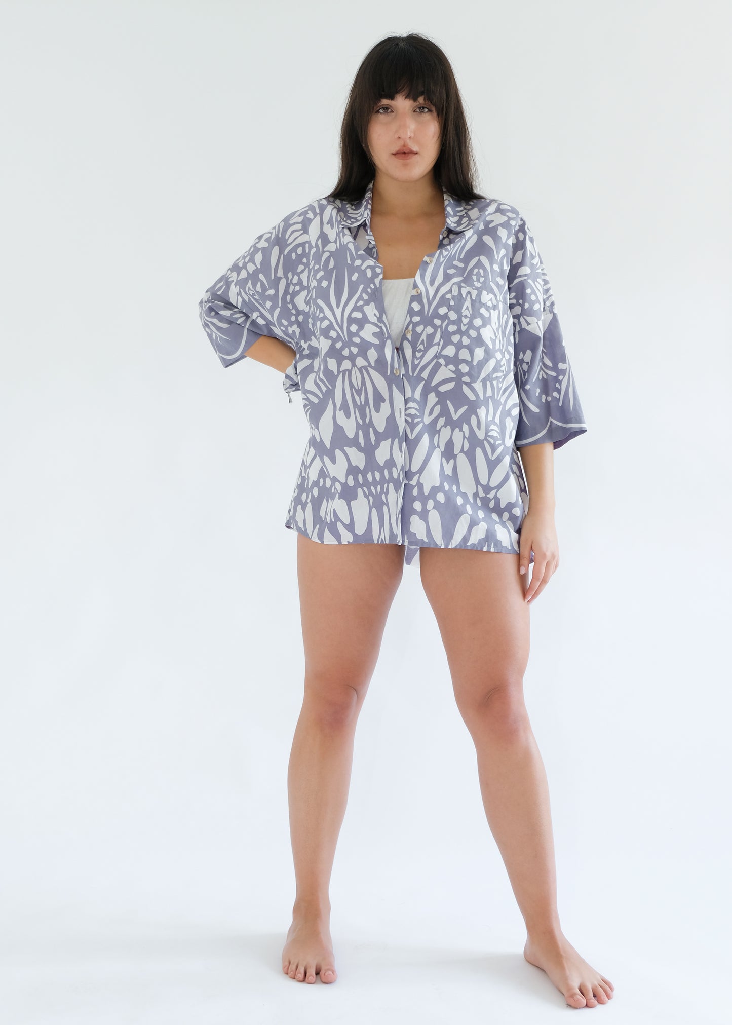 Girl standing wearing cotton shirt and white underwear set