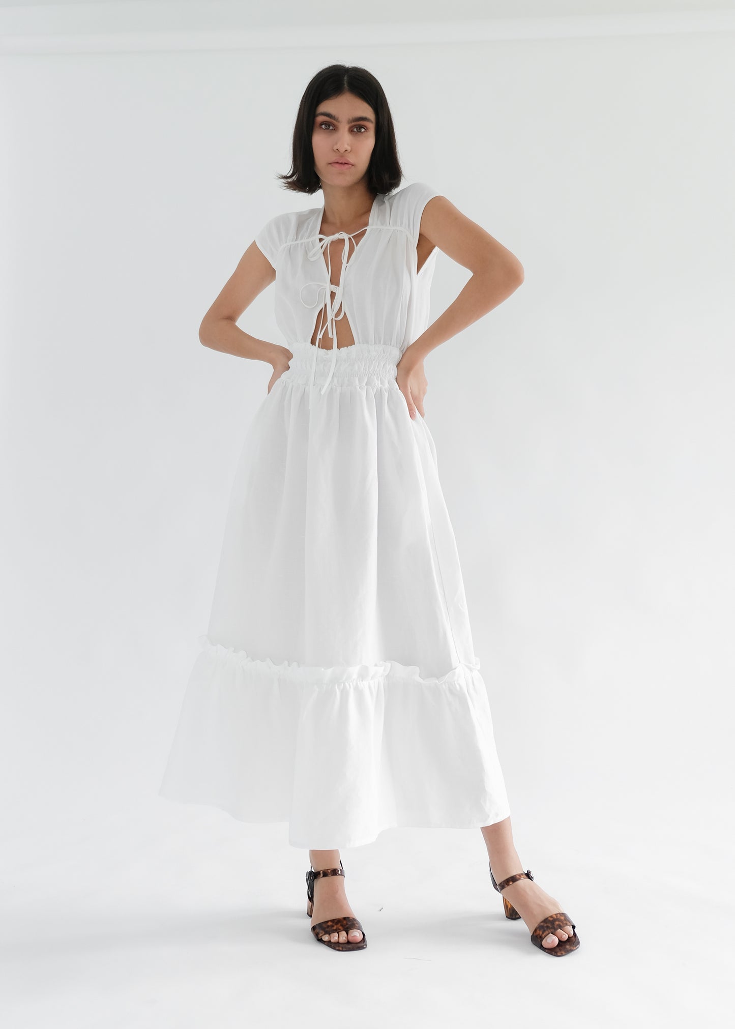 Girl standing wearing white midi dress