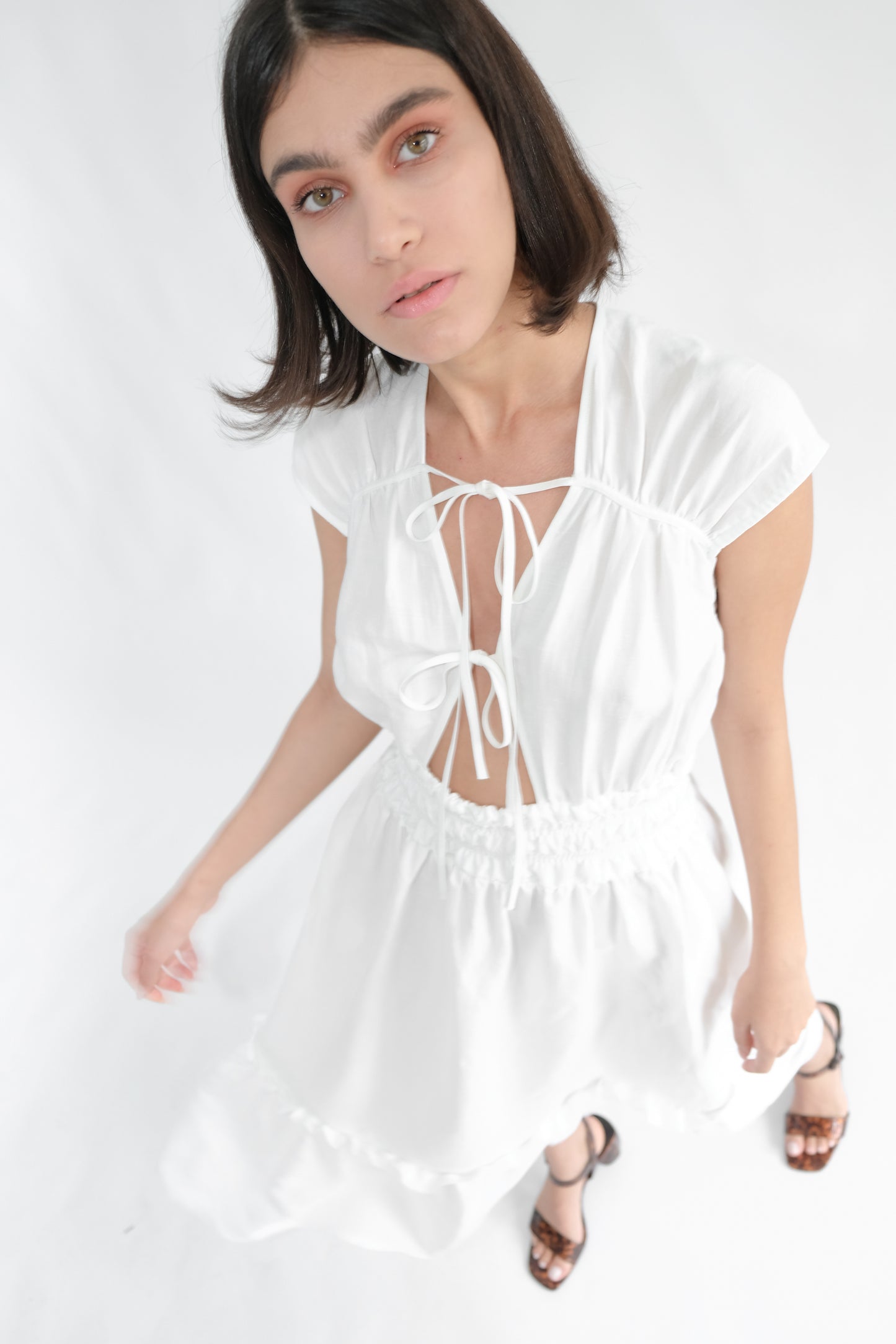 Girl standing wearing white midi dress