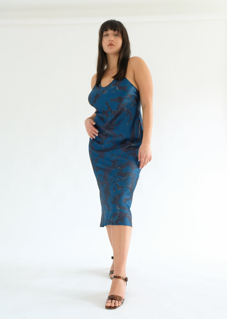Girl standing wearing blue printed midi dress