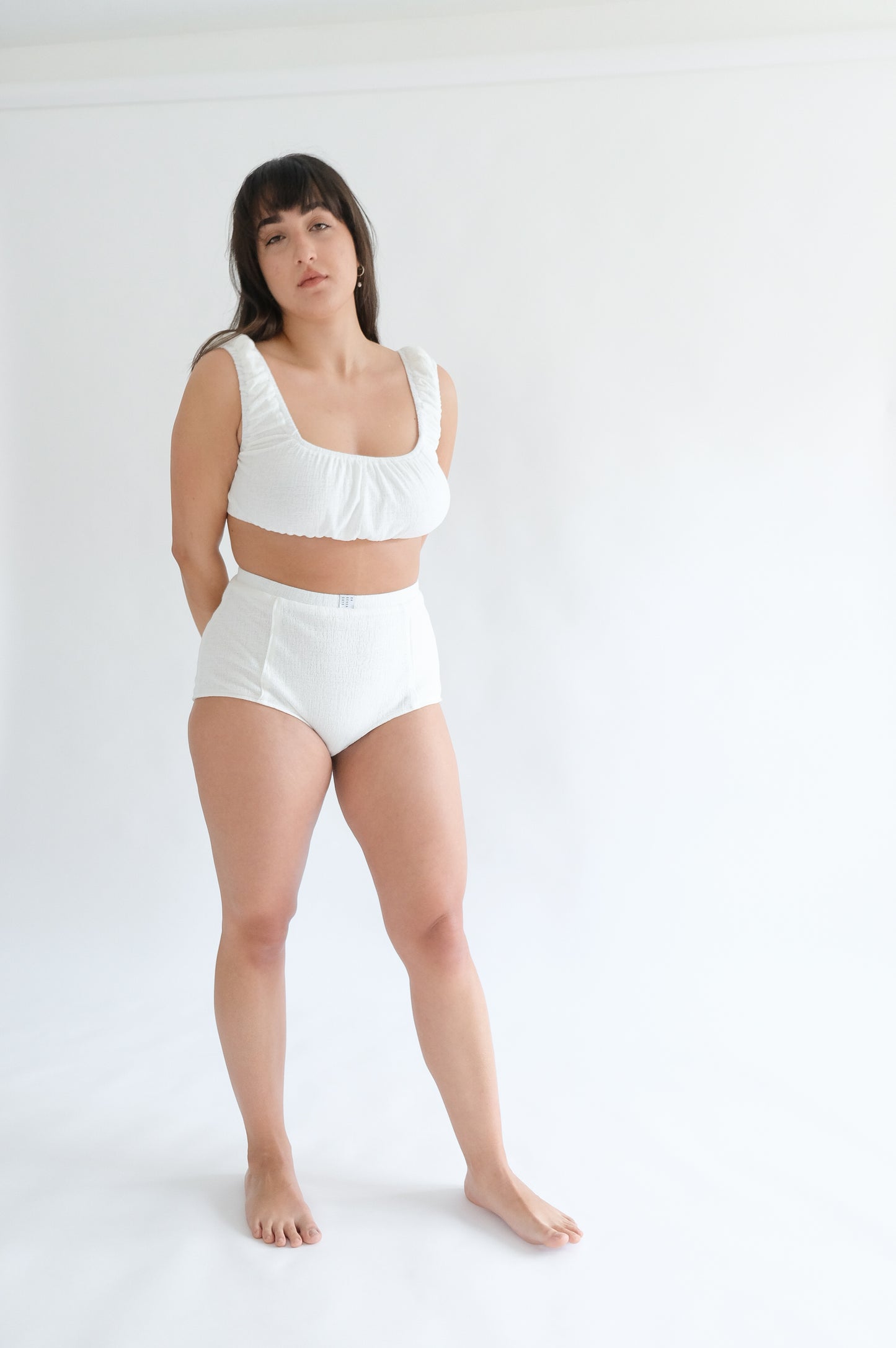 Girl standing wearing white underwear set