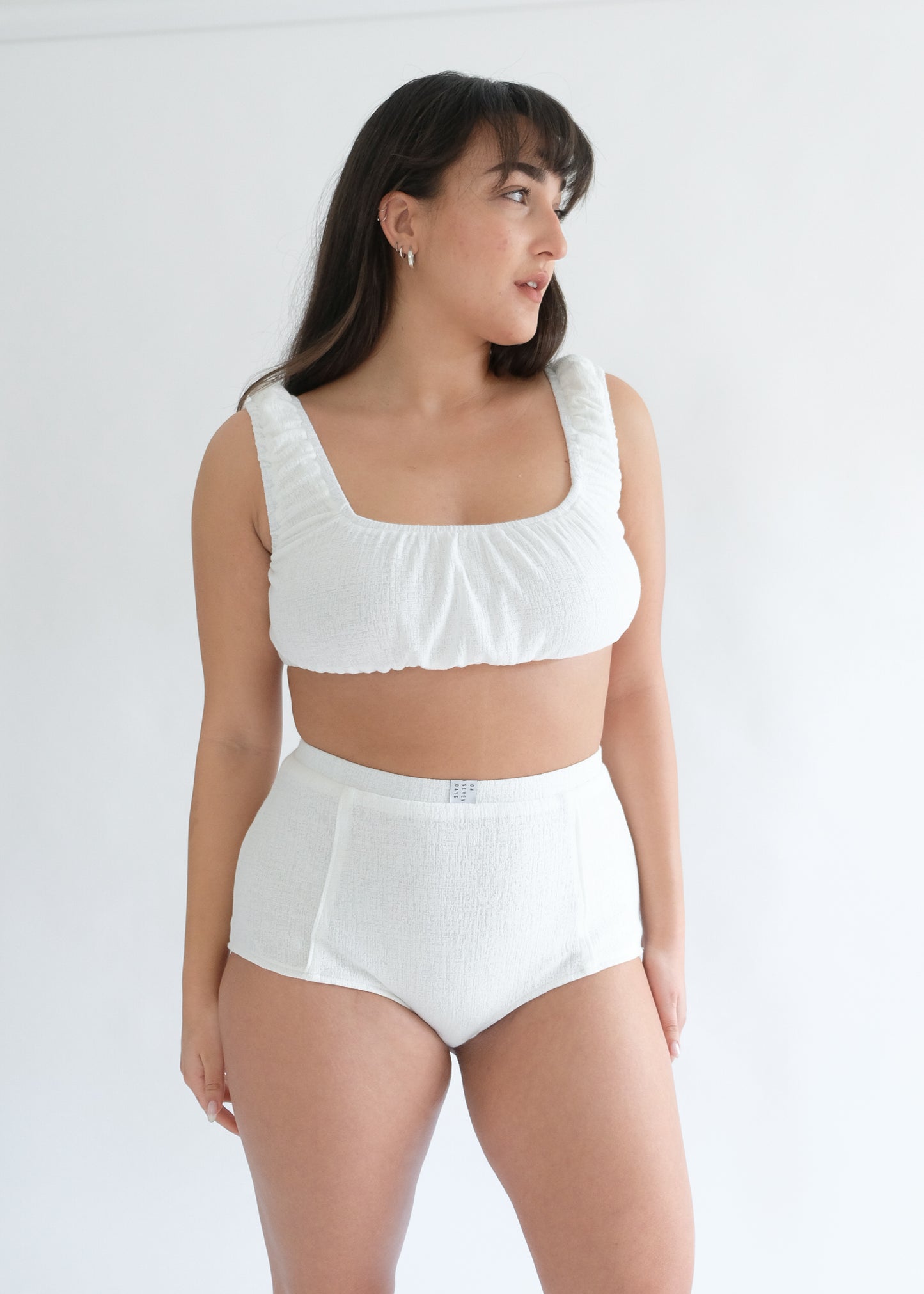 Girl standing wearing white underwear set