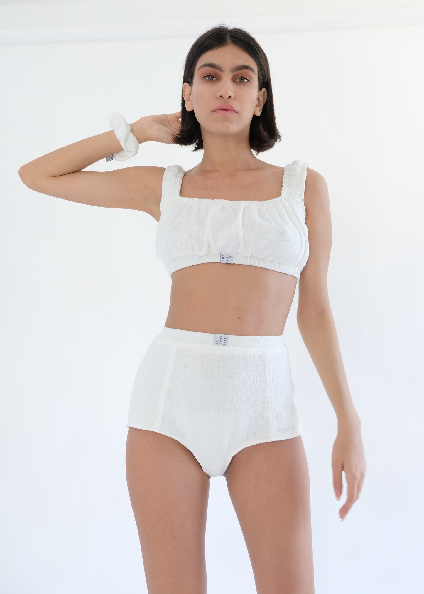 Girl standing wearing white underwear set