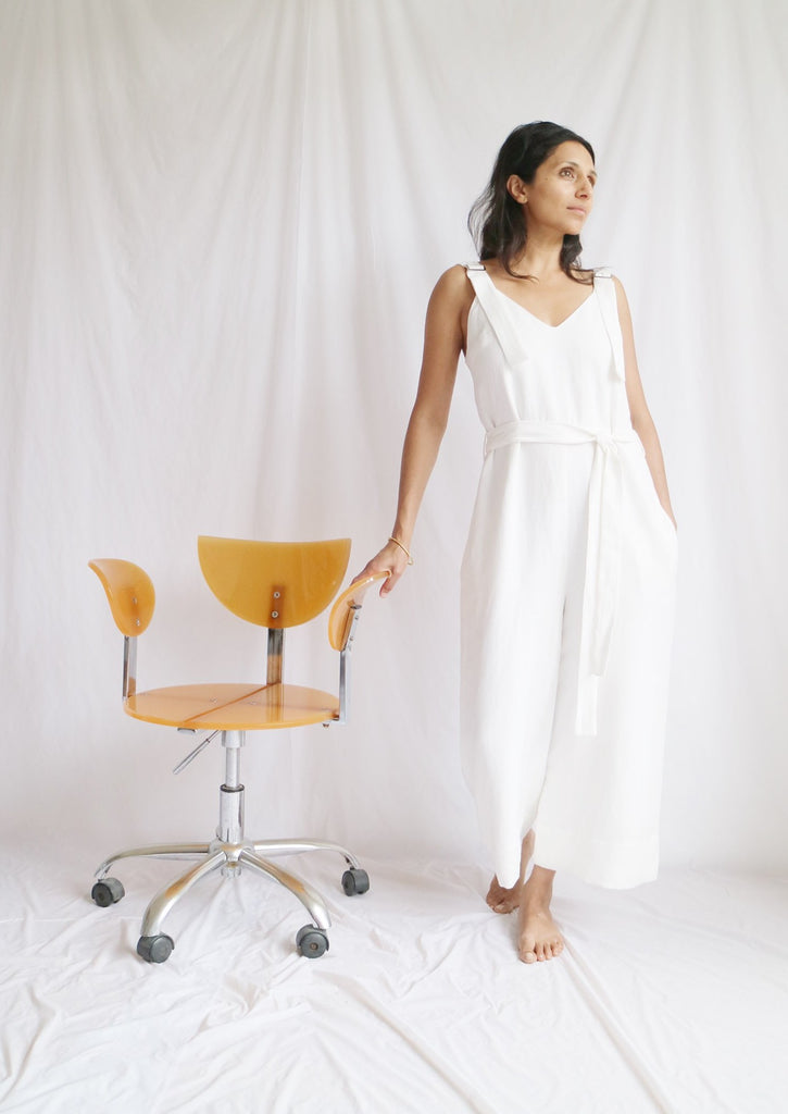  women's clothing, ethical clothing, dress, blouse, OhSevenDays, Woman standing next to a yellow chair wearing white jumpsuit