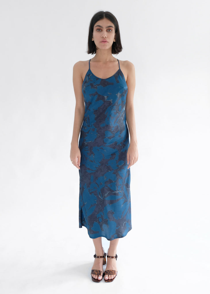 Girl standing wearing blue printed midi dress