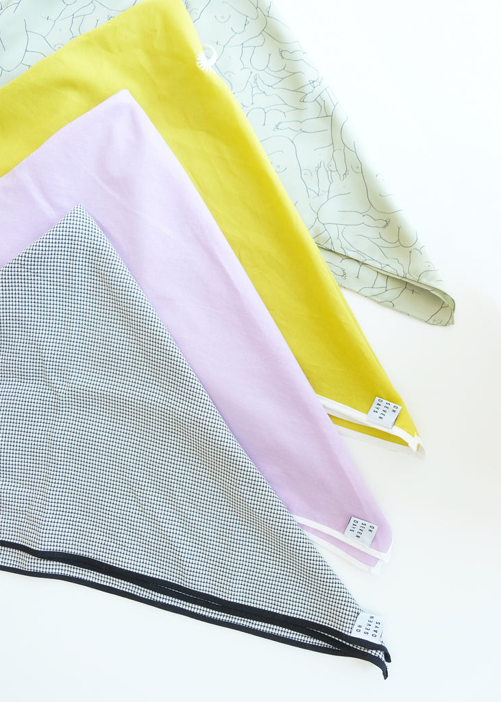Four scarves in colors green, yellow, lilac and black-white, triangles