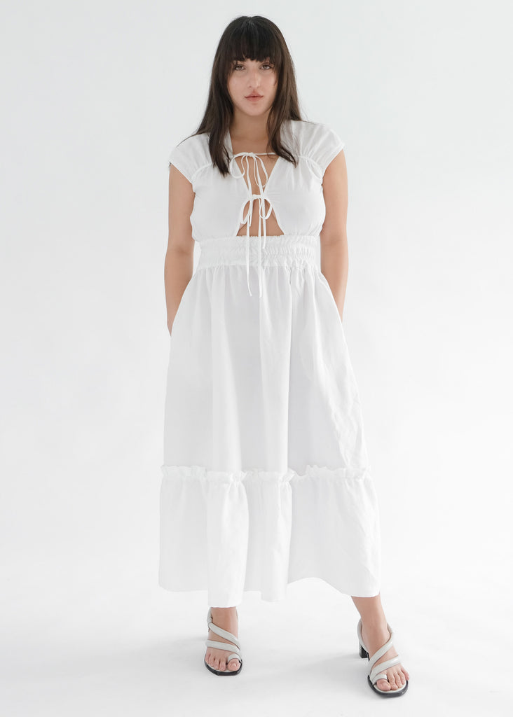 Girl standing wearing white midi dress