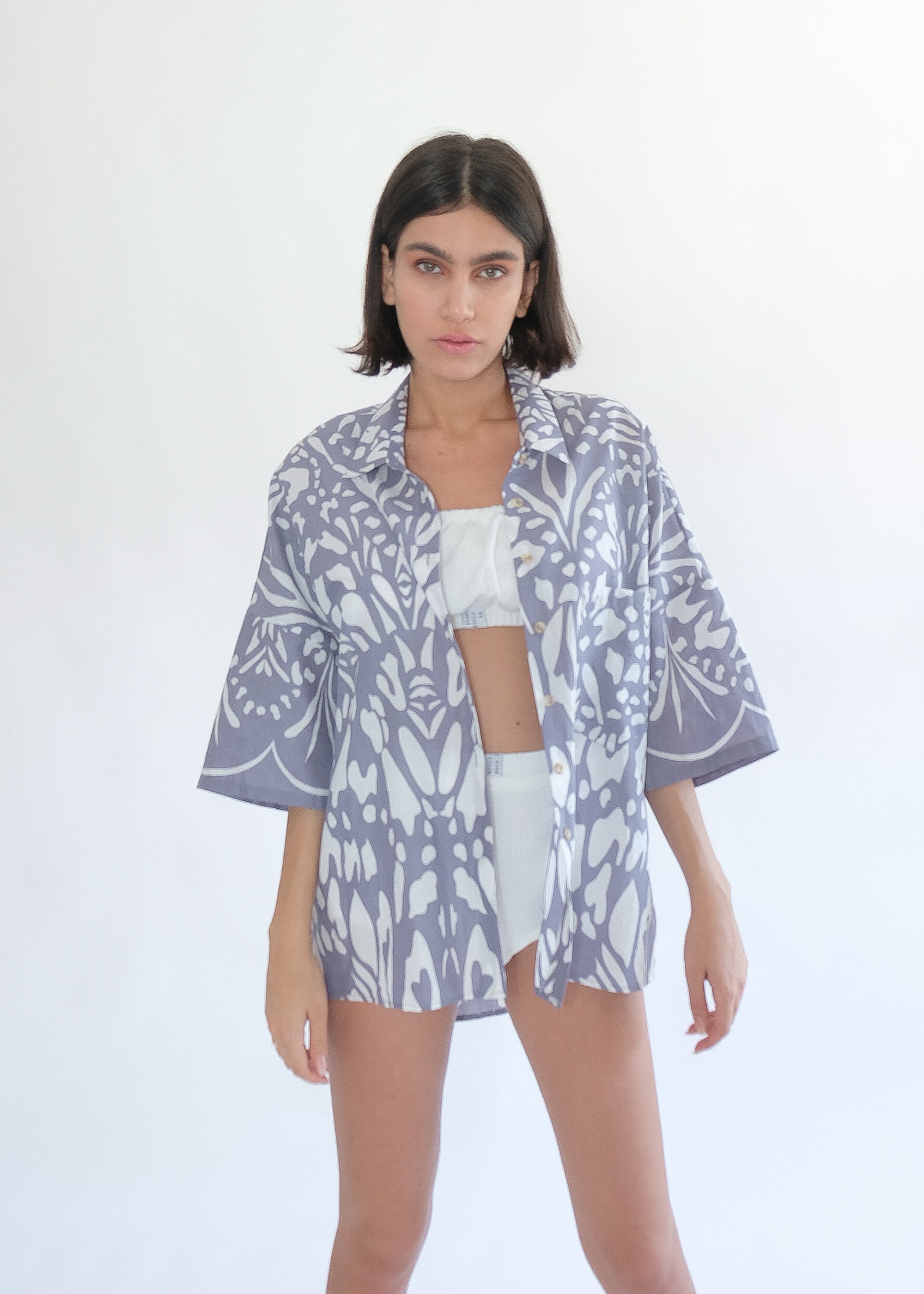 Girl standing wearing cotton shirt and white underwear set