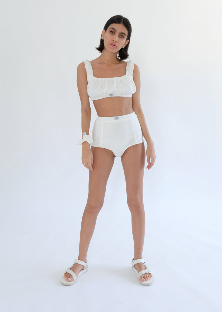 Girl standing wearing white underwear set