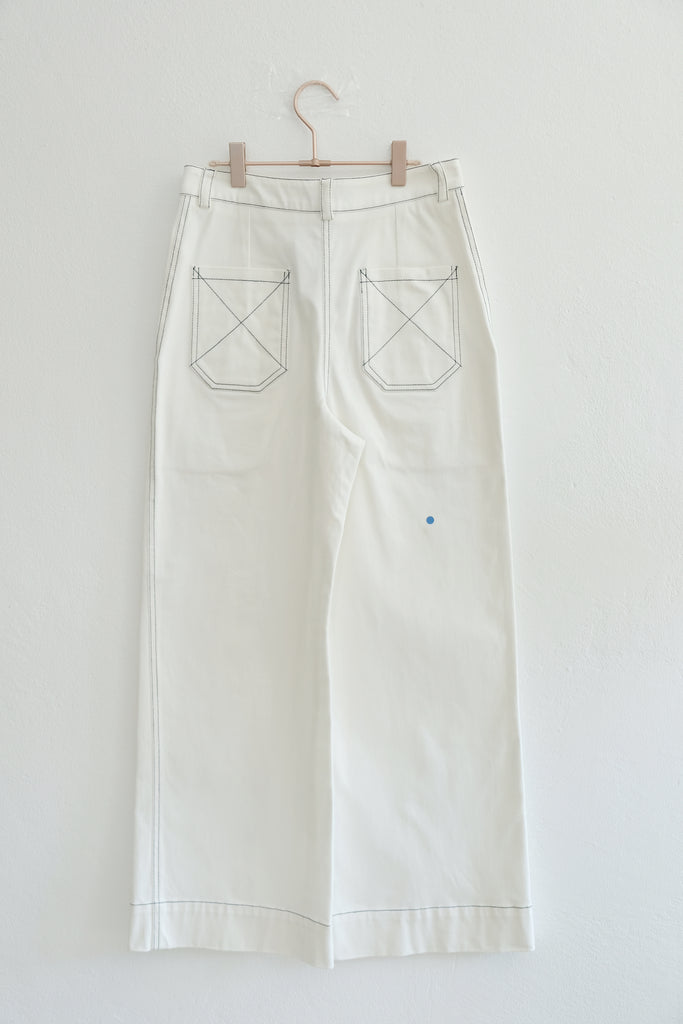 Back view of white wide legged pants on hanger